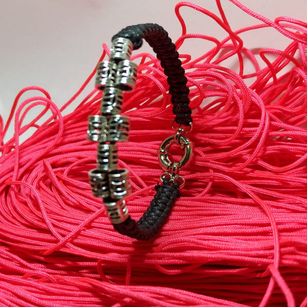 jewel paracord bracelet in waxed cotton with steel multibarrell
