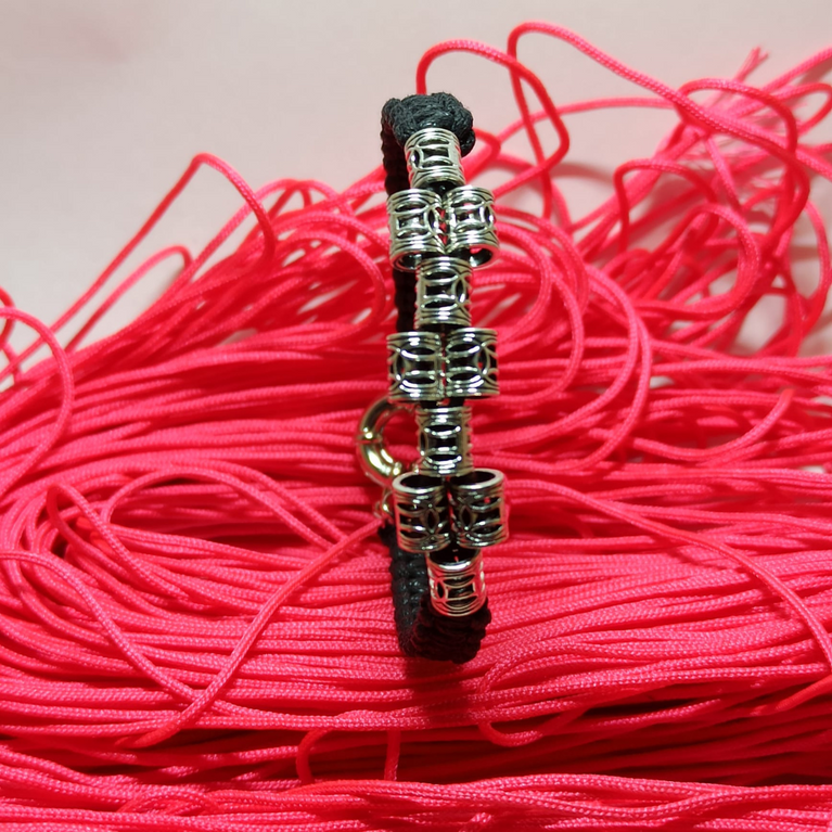 jewel paracord bracelet in waxed cotton with steel multibarrell